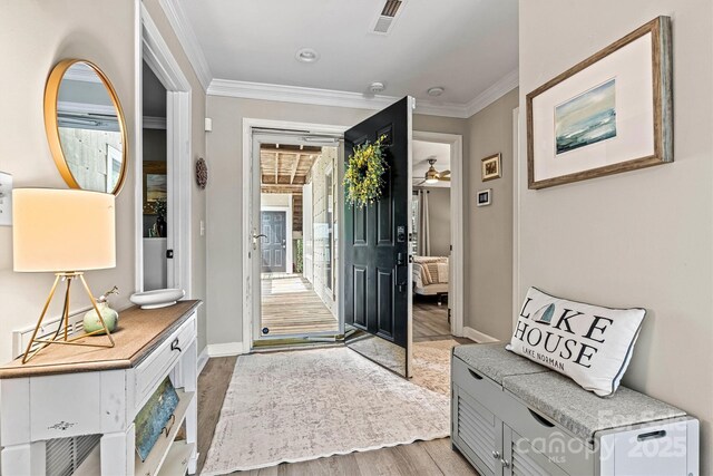 860 Jetton St Unit 59, Davidson, NC 28036 - entryway featuring ornamental molding, light wood-type flooring, and ceiling fan