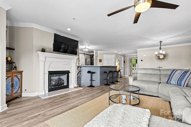 860 Jetton St Unit 59, Davidson, NC 28036 - living area with wood finished floors, a ceiling fan, ornamental molding, a high end fireplace, and recessed lighting