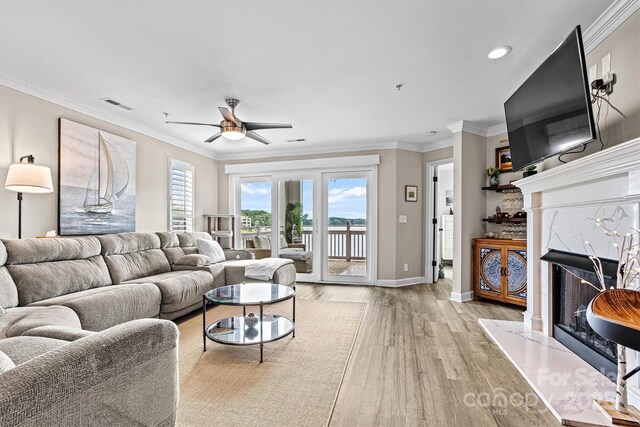 860 Jetton St Unit 59, Davidson, NC 28036 - living room with a ceiling fan, light wood-style flooring, crown molding, and recessed lighting