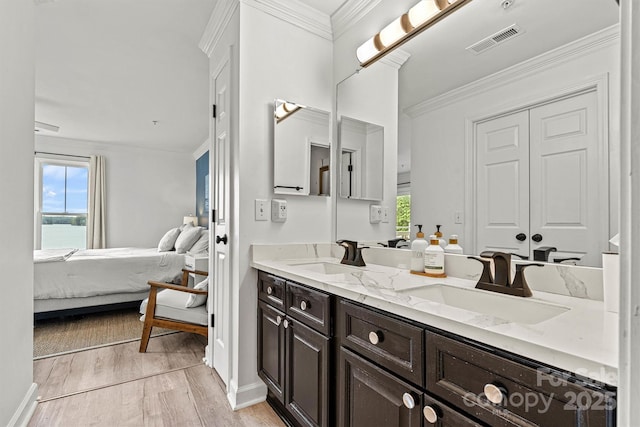 860 Jetton St Unit 59, Davidson, NC 28036 - full bathroom with double vanity, connected bathroom, wood finished floors, crown molding, and a water view