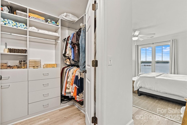 860 Jetton St Unit 59, Davidson, NC 28036 - bedroom with light wood-type flooring and a water view