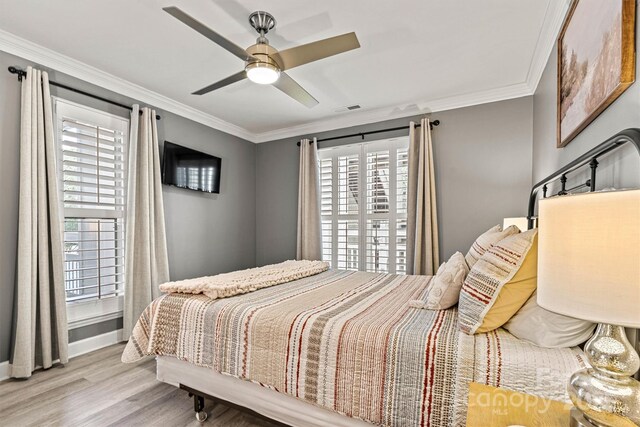 860 Jetton St Unit 59, Davidson, NC 28036 - bedroom with wood finished floors, ornamental molding, and ceiling fan