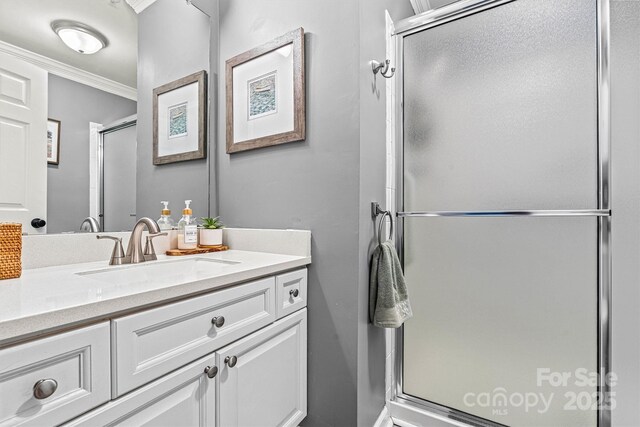 860 Jetton St Unit 59, Davidson, NC 28036 - bathroom featuring a stall shower, vanity, and ornamental molding