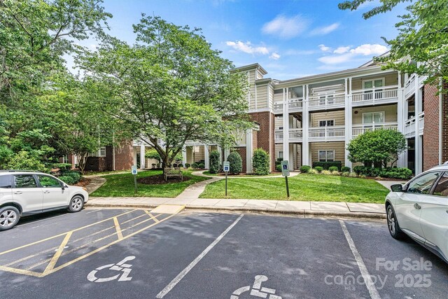 860 Jetton St Unit 59, Davidson, NC 28036 - view of building exterior featuring uncovered parking