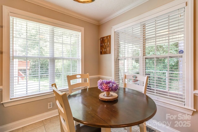 1 Loggerhead Dr, Columbia, SC 29229 - dining space featuring light tile patterned flooring, baseboards, a textured ceiling, and ornamental molding