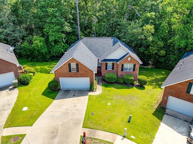 1 Loggerhead Dr, Columbia, SC 29229 - traditional-style home featuring a garage, brick siding, a front lawn, and roof with shingles
