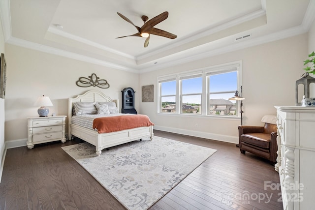 12410 Franklin Park Ln, Huntersville, NC 28078 - bedroom with a tray ceiling, dark wood-style flooring, ornamental molding, and ceiling fan