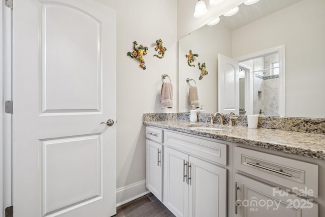 12410 Franklin Park Ln, Huntersville, NC 28078 - full bath featuring vanity, tiled shower, and wood finished floors