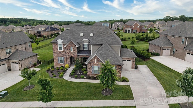 12410 Franklin Park Ln, Huntersville, NC 28078 - french country home featuring a residential view, stone siding, and driveway