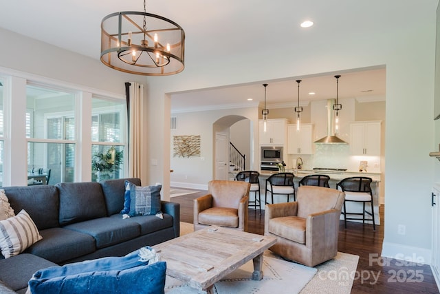 15103 Cimarron Hills Ln, Charlotte, NC 28278 - living room with arched walkways, stairs, recessed lighting, dark wood-style flooring, and baseboards