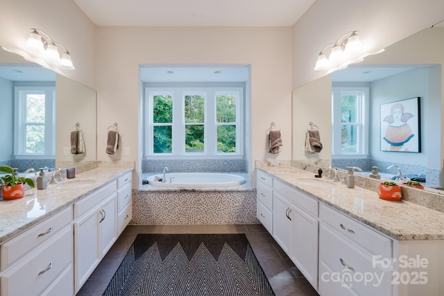 15103 Cimarron Hills Ln, Charlotte, NC 28278 - bathroom featuring two vanities, tile patterned flooring, and a bath