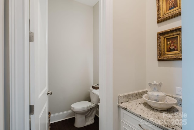 15103 Cimarron Hills Ln, Charlotte, NC 28278 - bathroom with toilet, vanity, wood finished floors, and baseboards