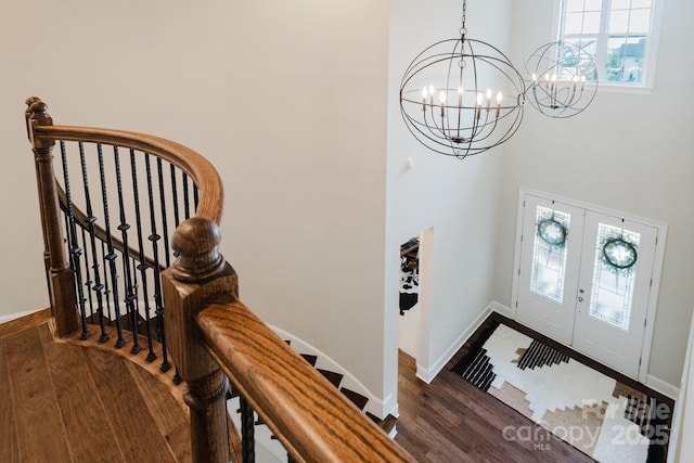 15103 Cimarron Hills Ln, Charlotte, NC 28278 - foyer entrance with wood finished floors, a high ceiling, a chandelier, baseboards, and french doors