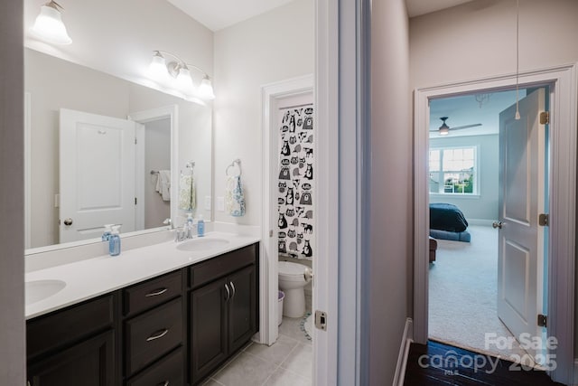 15103 Cimarron Hills Ln, Charlotte, NC 28278 - bathroom with toilet, double vanity, and a ceiling fan