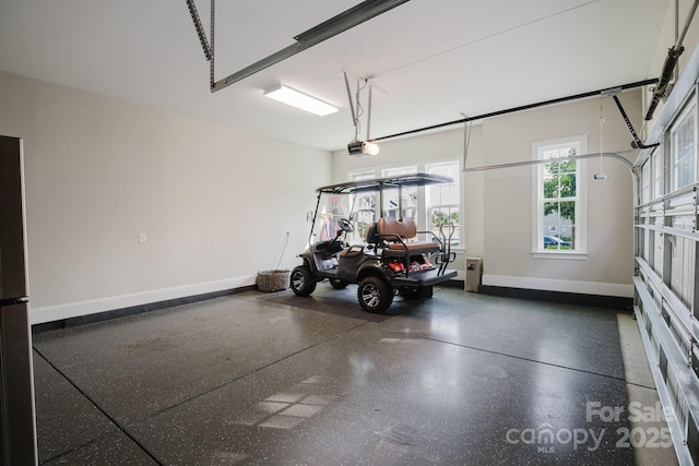 15103 Cimarron Hills Ln, Charlotte, NC 28278 - garage featuring baseboards and a garage door opener