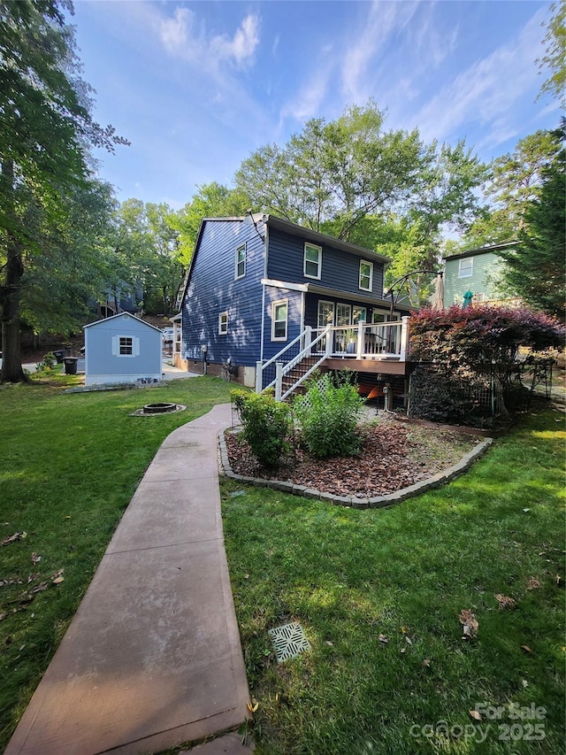 27092 Village Dr, Tega Cay, SC 29708 - back of property with a wooden deck, a yard, and stairway