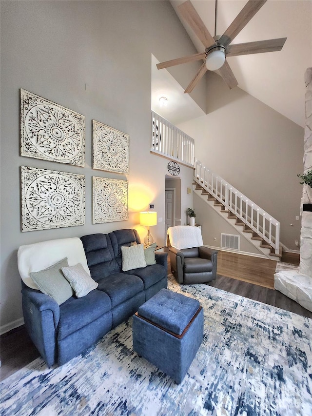 27092 Village Dr, Tega Cay, SC 29708 - living area with stairway, a ceiling fan, wood finished floors, and high vaulted ceiling