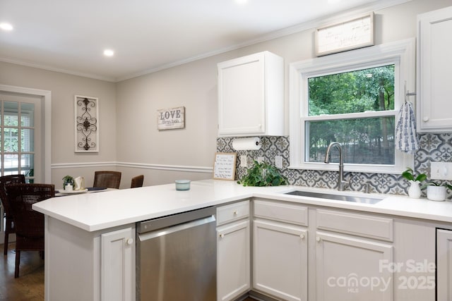 27092 Village Dr, Tega Cay, SC 29708 - kitchen featuring stainless steel dishwasher, a peninsula, decorative backsplash, white cabinetry, and light countertops