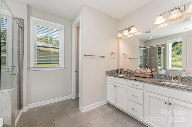 2606 Cheverny Pl, Concord, NC 28027 - bathroom with plenty of natural light, double vanity, and a stall shower