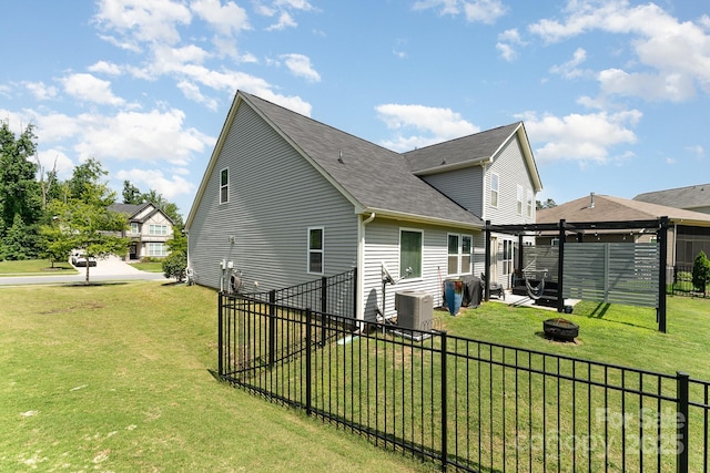 2606 Cheverny Pl, Concord, NC 28027 - view of side of property featuring an outdoor fire pit and a shingled roof