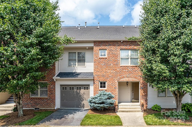 234 Wash Creek Dr Unit B, Hendersonville, NC 28739 - view of property with driveway, an attached garage, roof with shingles, and brick siding