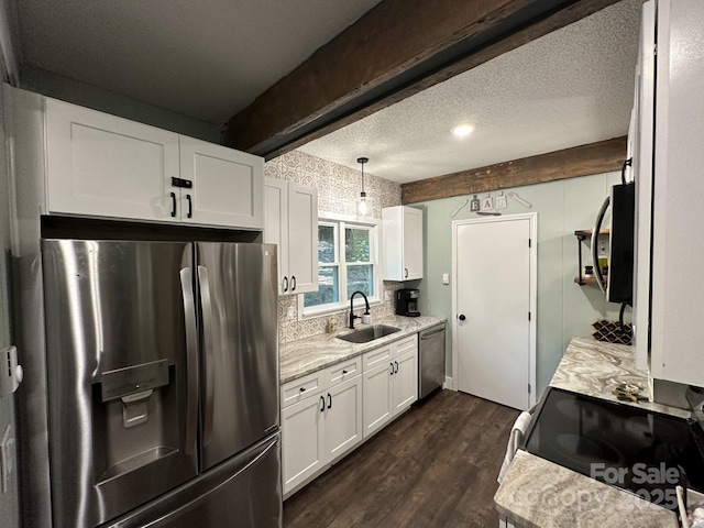 630 Shumont Rd, Black Mountain, NC 28711 - kitchen featuring stainless steel appliances, a sink, white cabinetry, dark wood-type flooring, and beam ceiling
