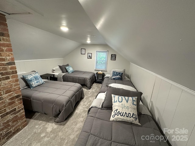 630 Shumont Rd, Black Mountain, NC 28711 - bedroom featuring vaulted ceiling, carpet flooring, and brick wall