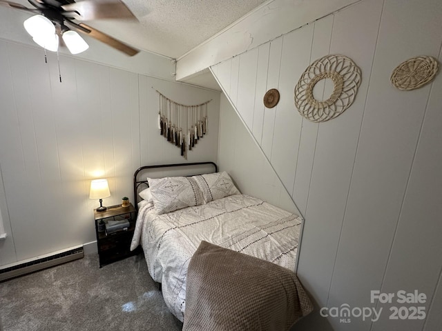 630 Shumont Rd, Black Mountain, NC 28711 - bedroom featuring a baseboard heating unit, carpet floors, a textured ceiling, and a ceiling fan