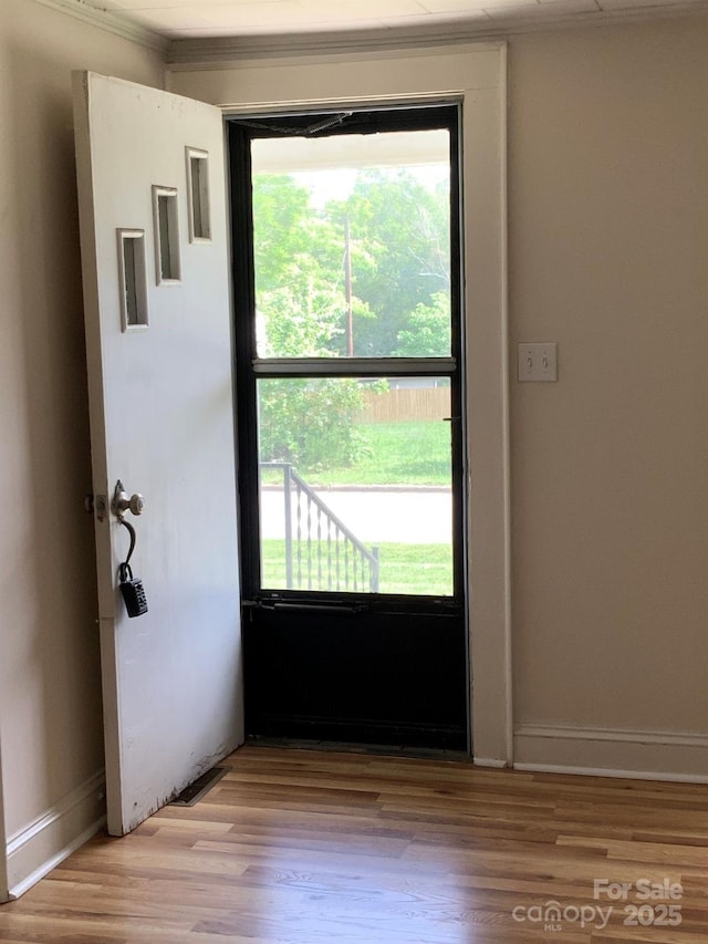 1721 9th Ave NE, Hickory, NC 28601 - doorway featuring light wood finished floors, ornamental molding, and baseboards