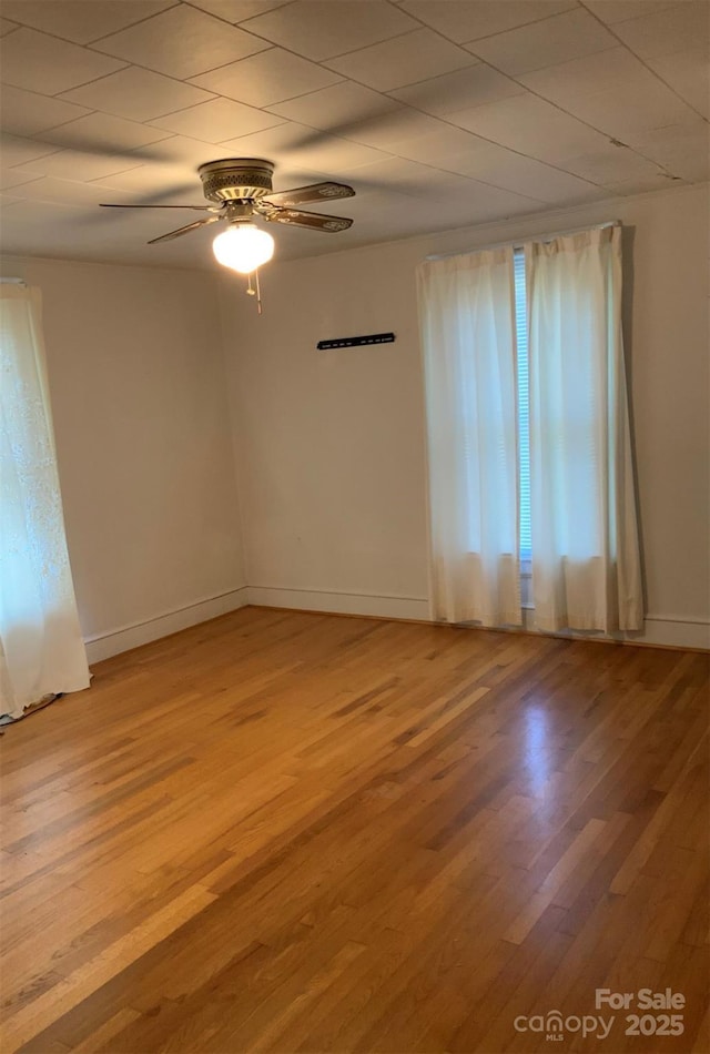 1721 9th Ave NE, Hickory, NC 28601 - empty room with light wood-style floors, ceiling fan, and baseboards