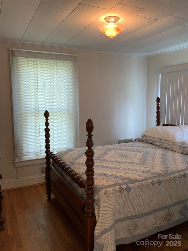 1721 9th Ave NE, Hickory, NC 28601 - bedroom with wood finished floors, crown molding, and baseboards