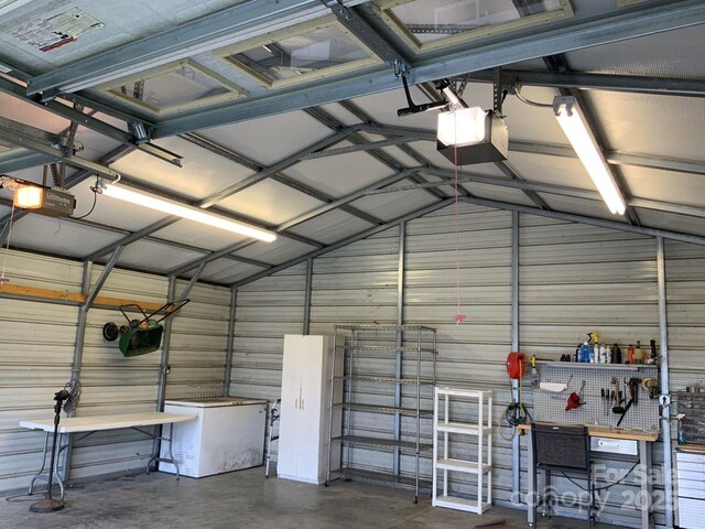 1721 9th Ave NE, Hickory, NC 28601 - garage with a garage door opener, fridge, and wooden walls