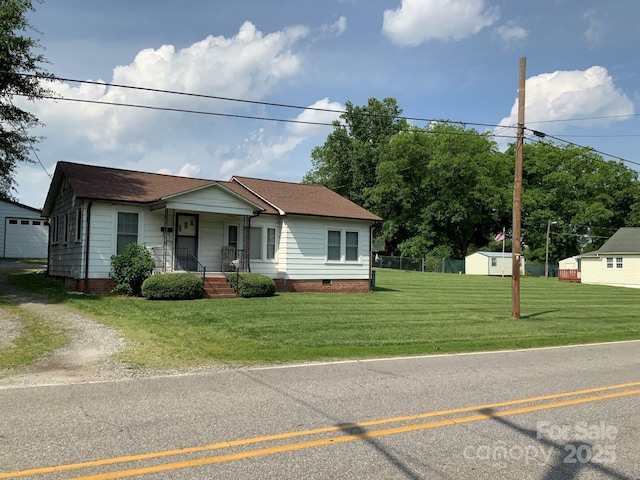 1721 9th Ave NE, Hickory, NC 28601 - view of front of home with a porch, an outdoor structure, a front yard, crawl space, and driveway