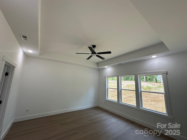 953 Mike Cir, Spartanburg, SC 29303 - spare room featuring a raised ceiling, dark wood-style floors, a ceiling fan, baseboards, and recessed lighting