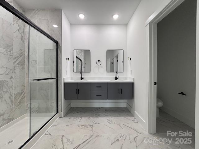953 Mike Cir, Spartanburg, SC 29303 - bathroom featuring marble finish flooring, a stall shower, double vanity, toilet, and recessed lighting