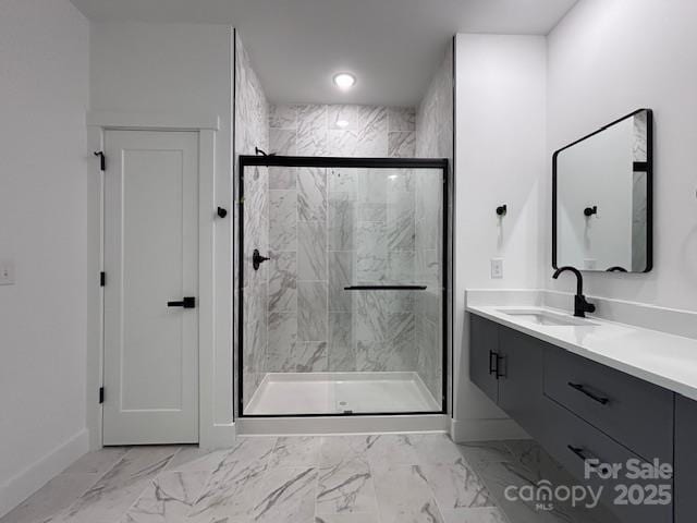 953 Mike Cir, Spartanburg, SC 29303 - bathroom featuring baseboards, marble look tile flooring, vanity, and a stall shower