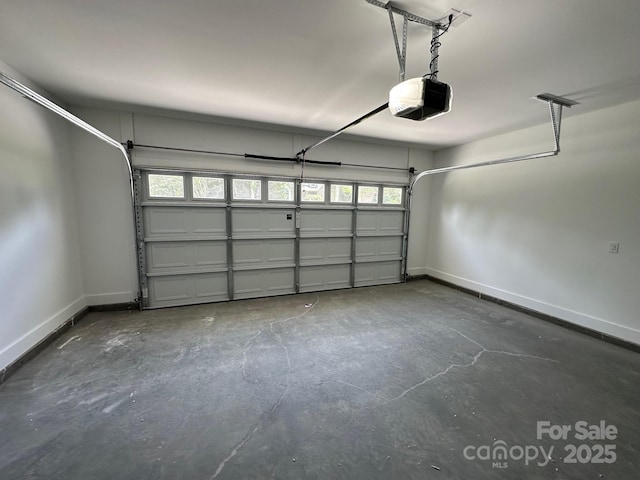 953 Mike Cir, Spartanburg, SC 29303 - garage with a garage door opener and baseboards