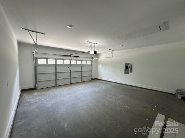 953 Mike Cir, Spartanburg, SC 29303 - garage featuring electric panel, baseboards, and a garage door opener