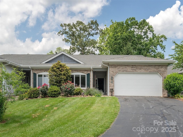 12 Country Meadows Ln, Hendersonville, NC 28792 - ranch-style home with brick siding, a front lawn, a garage, asphalt driveway, and a shingled roof