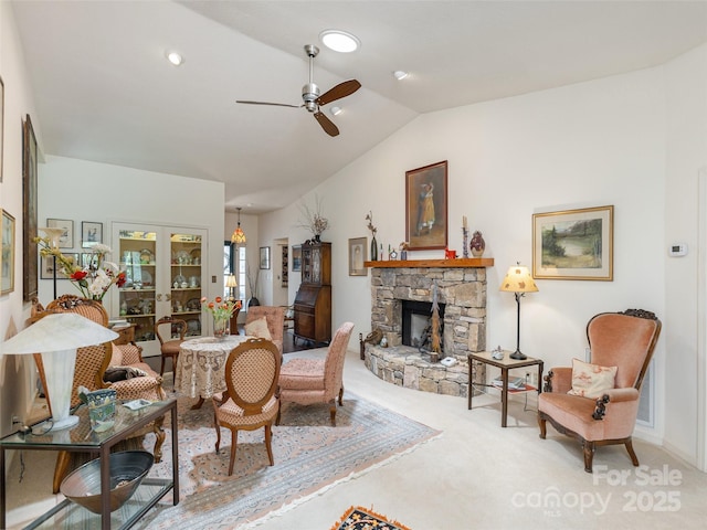 12 Country Meadows Ln, Hendersonville, NC 28792 - carpeted living area featuring vaulted ceiling, ceiling fan, and a stone fireplace