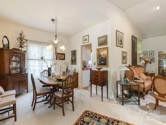 12 Country Meadows Ln, Hendersonville, NC 28792 - dining room with light carpet, a chandelier, and vaulted ceiling