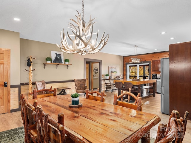 110 Garden Knoll Rd, Franklin, NC 28734 - dining area with wood walls, light wood-style floors, recessed lighting, a chandelier, and a wainscoted wall