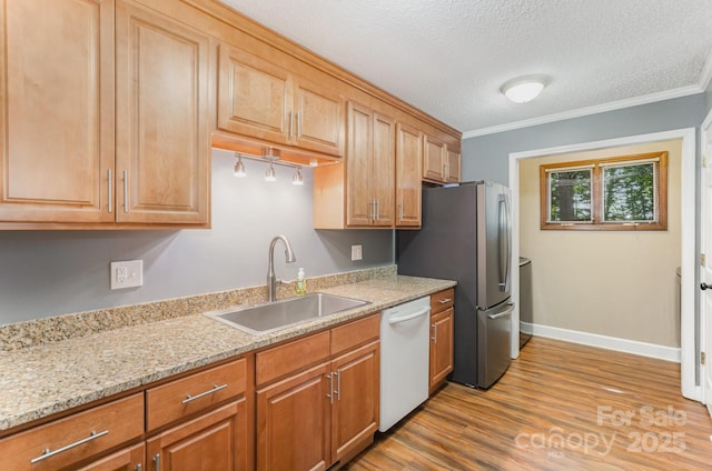 110 Hidden Valley St, Cherryville, NC 28021 - kitchen featuring white dishwasher, freestanding refrigerator, wood finished floors, light stone countertops, and ornamental molding