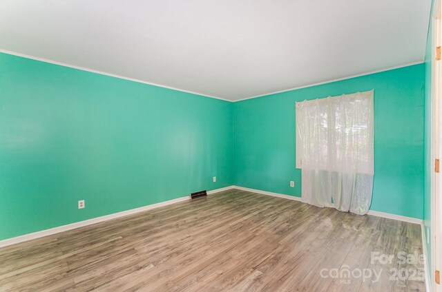 110 Hidden Valley St, Cherryville, NC 28021 - spare room featuring wood finished floors and ornamental molding