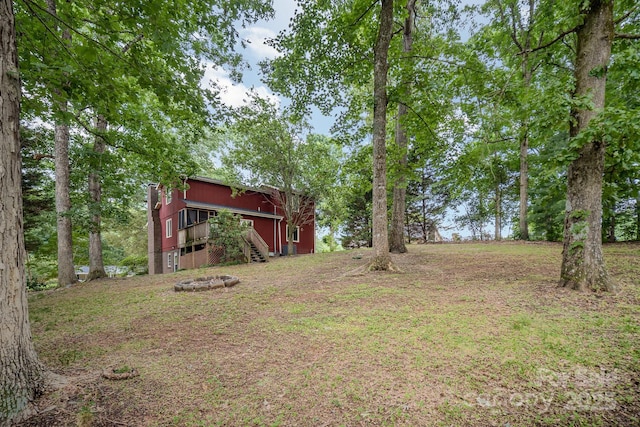 110 Hidden Valley St, Cherryville, NC 28021 - view of yard featuring an outdoor fire pit, stairway, and a wooden deck