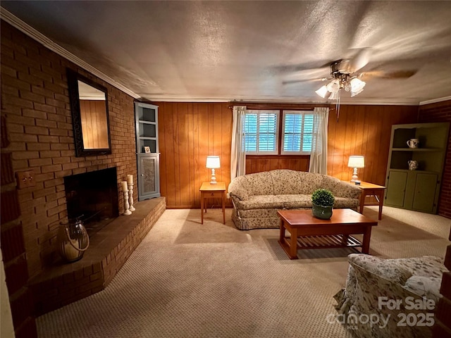 211 S Slack St, Albemarle, NC 28001 - living area featuring light carpet, a ceiling fan, wood walls, a fireplace, and crown molding