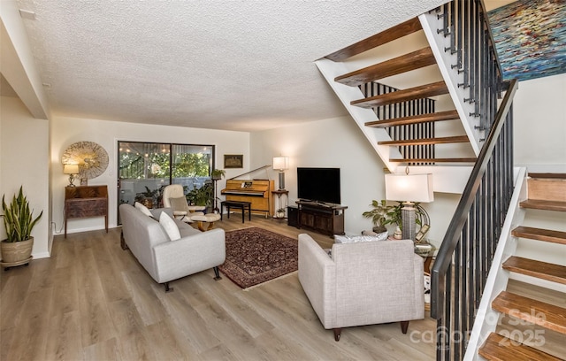 503 Crowfields Ln, Asheville, NC 28803 - living area with stairway, a textured ceiling, and wood finished floors