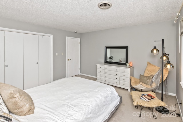 503 Crowfields Ln, Asheville, NC 28803 - carpeted bedroom with a closet and a textured ceiling
