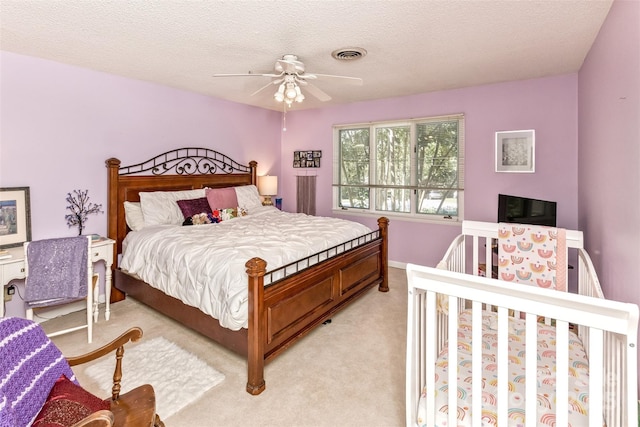 503 Crowfields Ln, Asheville, NC 28803 - bedroom featuring light carpet, ceiling fan, and a textured ceiling
