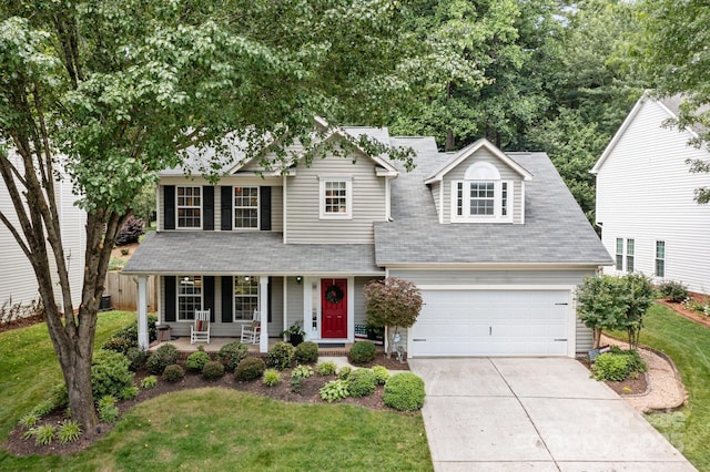 8700 Fox Tail Ln, Huntersville, NC 28078 - view of front of home with a porch, a front yard, driveway, and a shingled roof